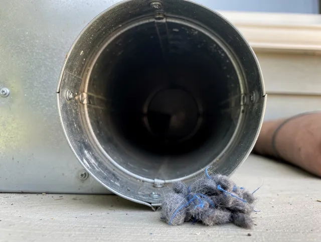 Pooler Dryer Vent Cleaning technician using specialized equipment to clear severe dryer vent blockage in Pooler